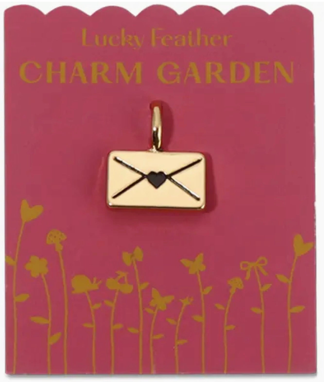 Gold envelope charm on a 'Lucky Feather Charm Garden' card with floral design