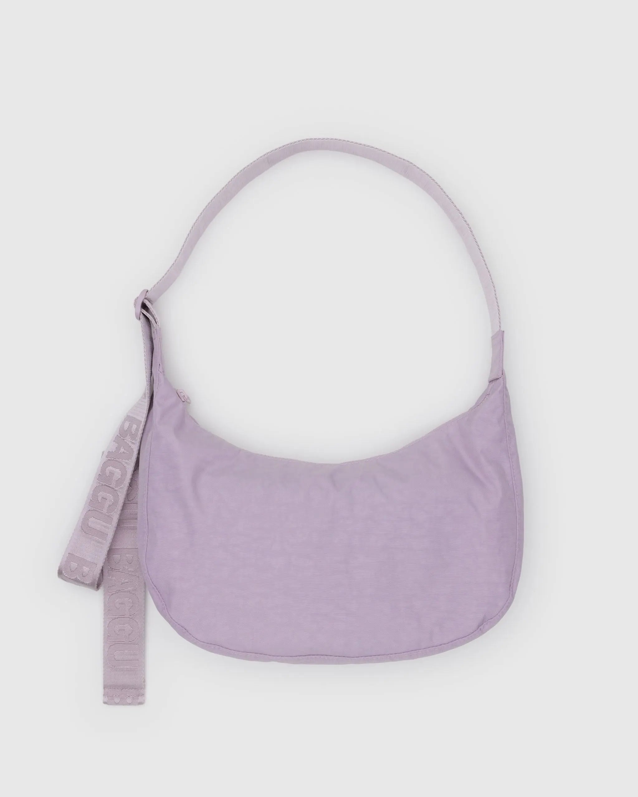 Purple handbag with a strap on a light purple Bag