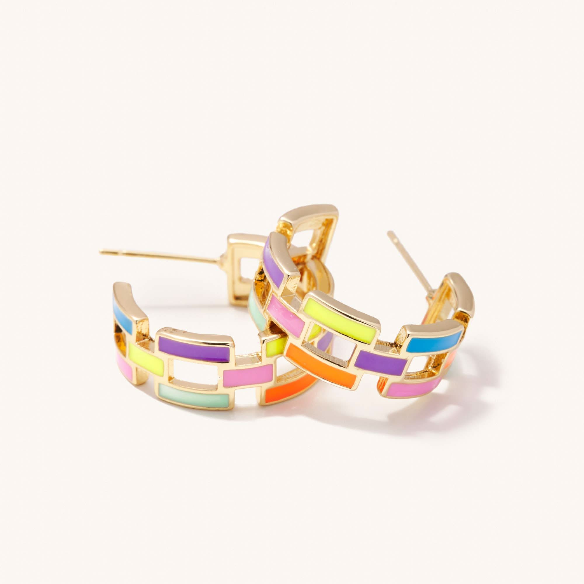 Colorful hoop earrings with gold accents on a white background