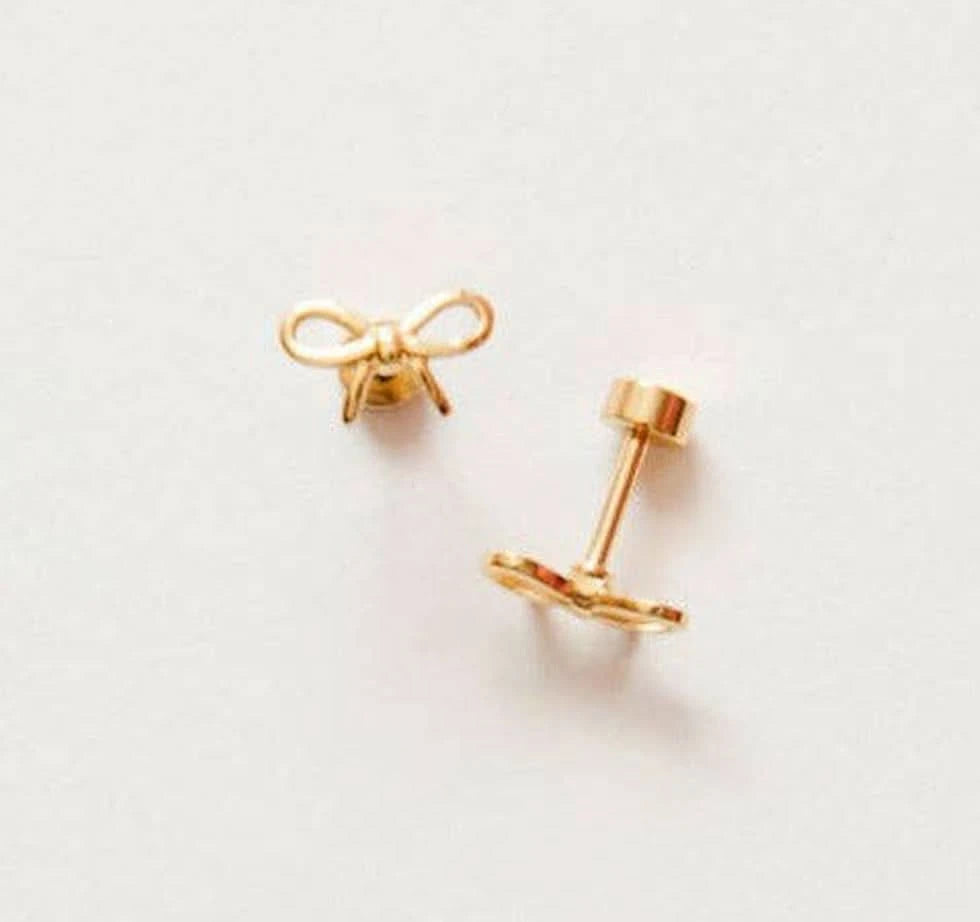 Pip Pop Flat Back Earrings - Bow Gold bow-shaped earrings on a light gray background