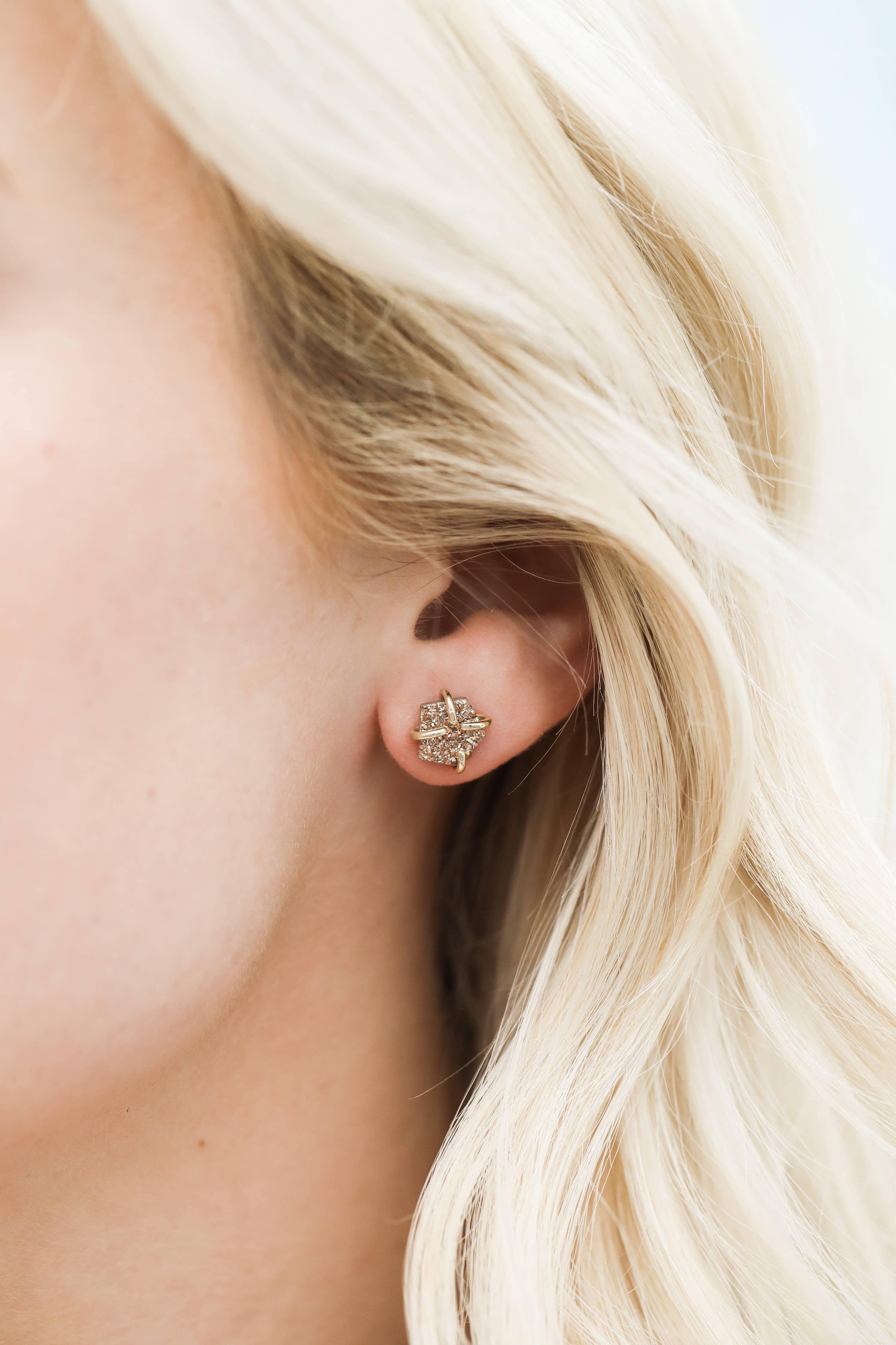 Close-up of a person wearing a diamond Rose Gold Druzy Prong Gold Earrings