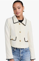 white Moon River cropped blazer with black trim and gold buttons