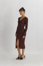 woman wearing brown midi length silhouette dress with v-neckline, collar, button-front detail and waist belt for  shape