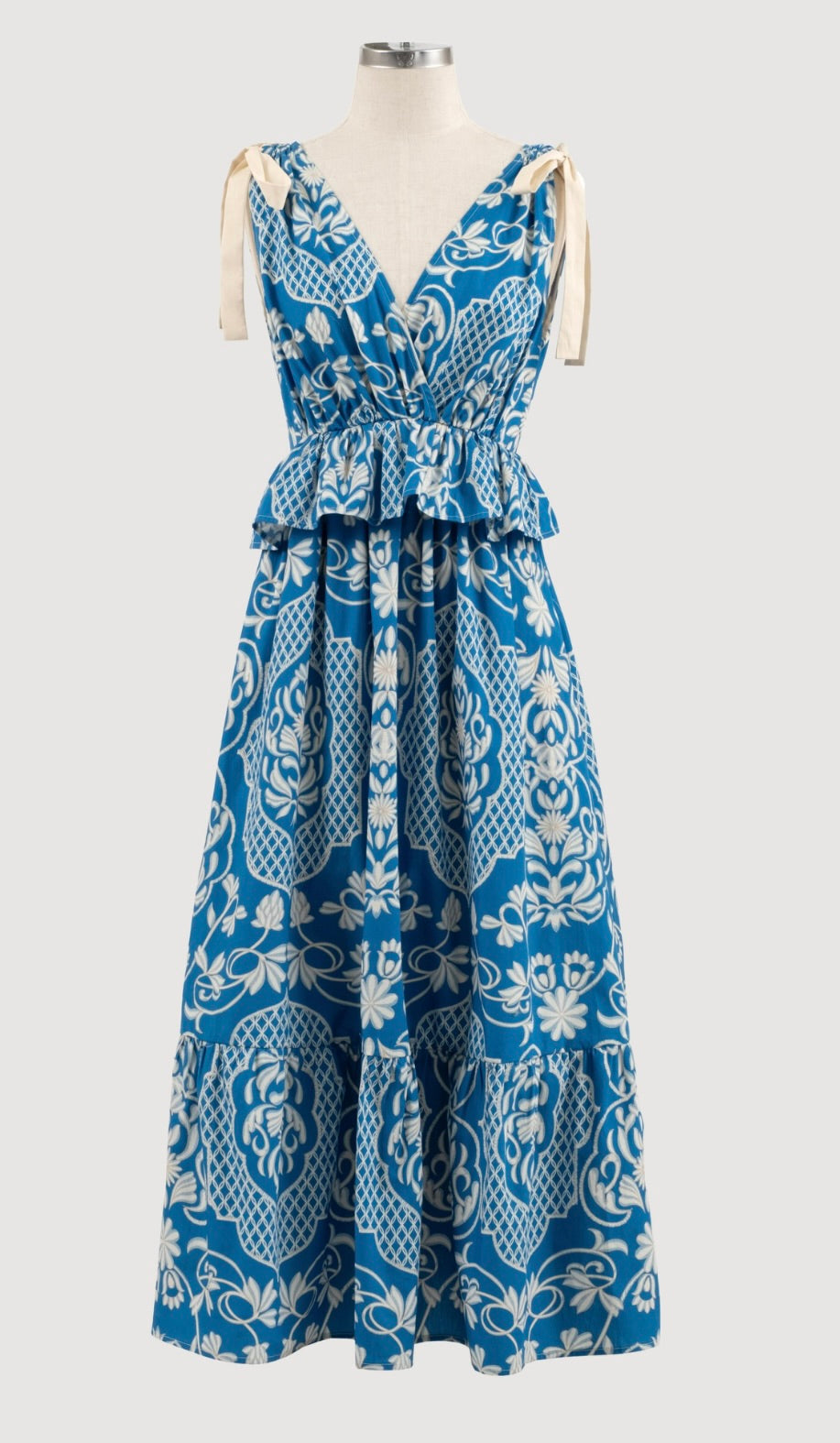 Cream and blue ruffle midi dress with floral pattern and cream ribbon for bow on each shoulder 