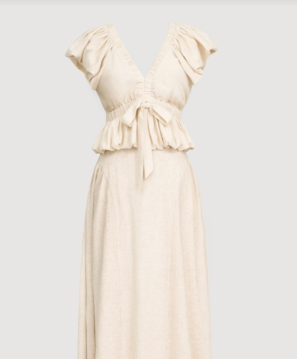 cream beige blouse with delicate ruffle details and voluminous sleeves and matching skirt 