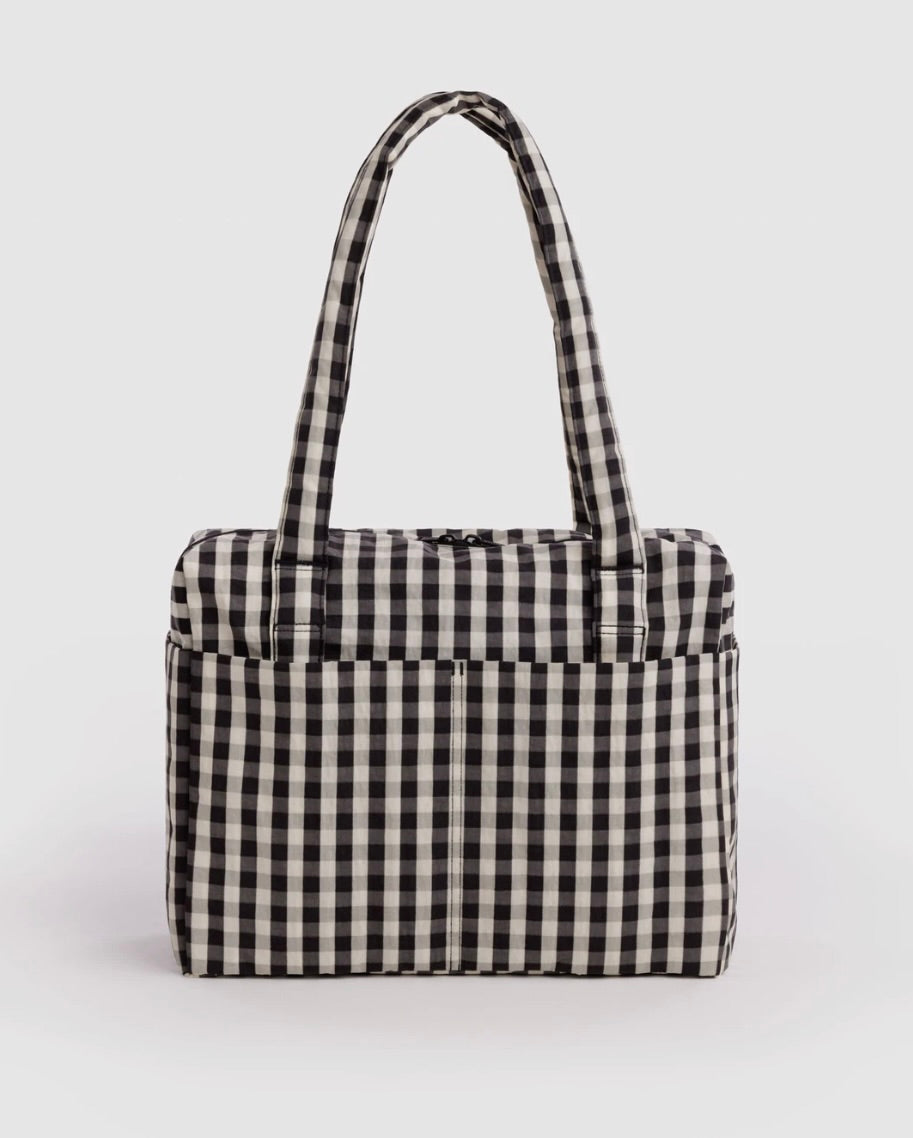 A black and white gingham checkered tote bag with two shoulder straps, shown against a plain light gray background.