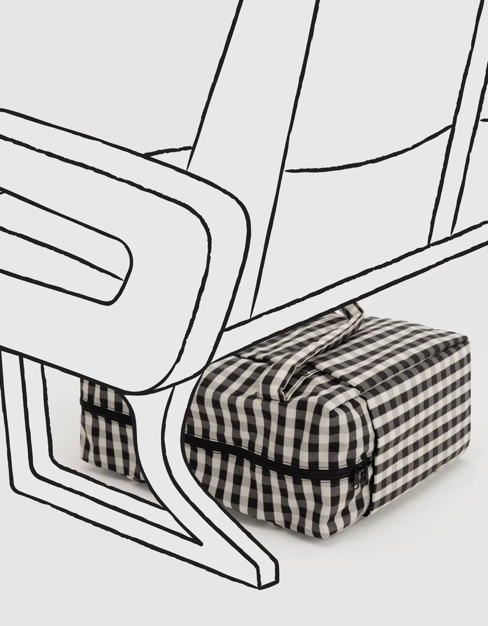 A black and white gingham check toiletry bag with a black zipper, shown under a minimalist black line drawing of a chair on a light gray background.