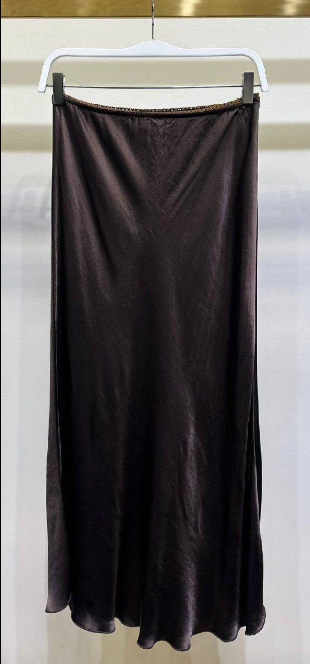 Brown skirt on a hanger Stay cool and stylish all day with its lightweight and smooth texture.