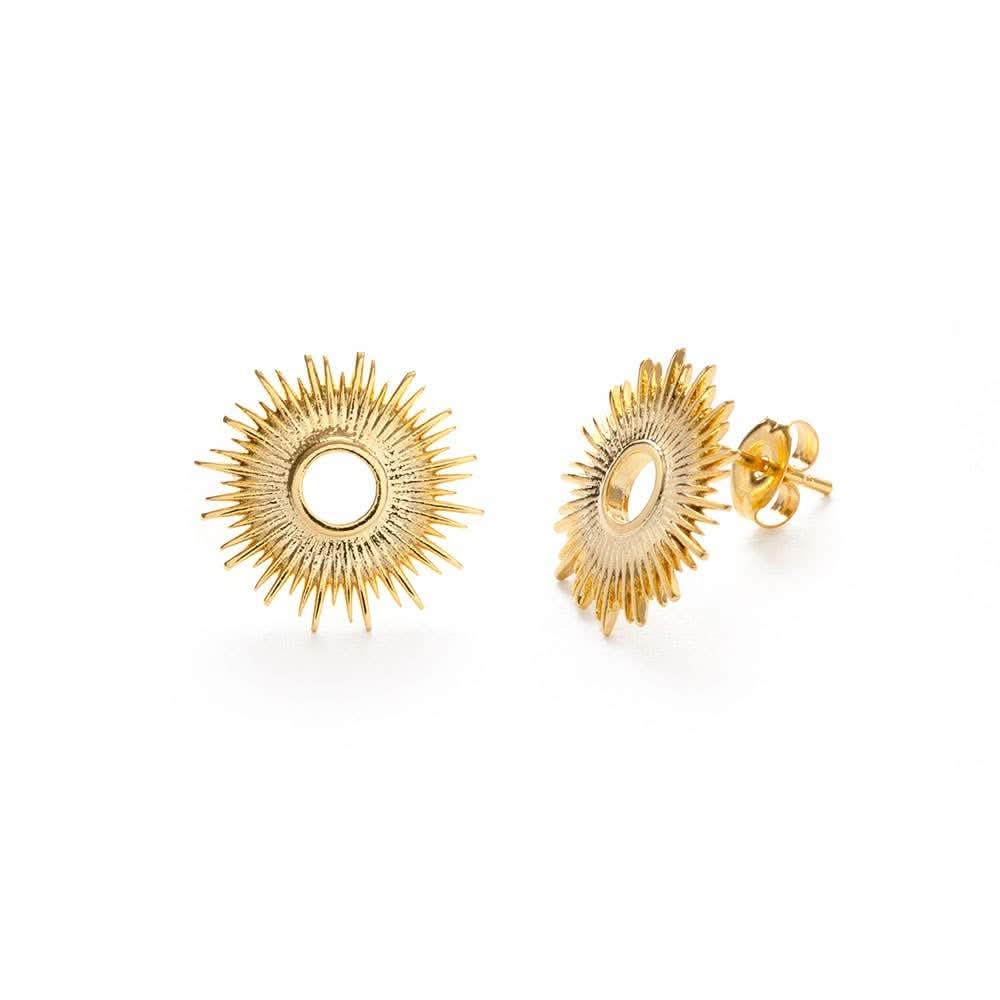 Gold stud earrings in a circle sunburst pattern pair