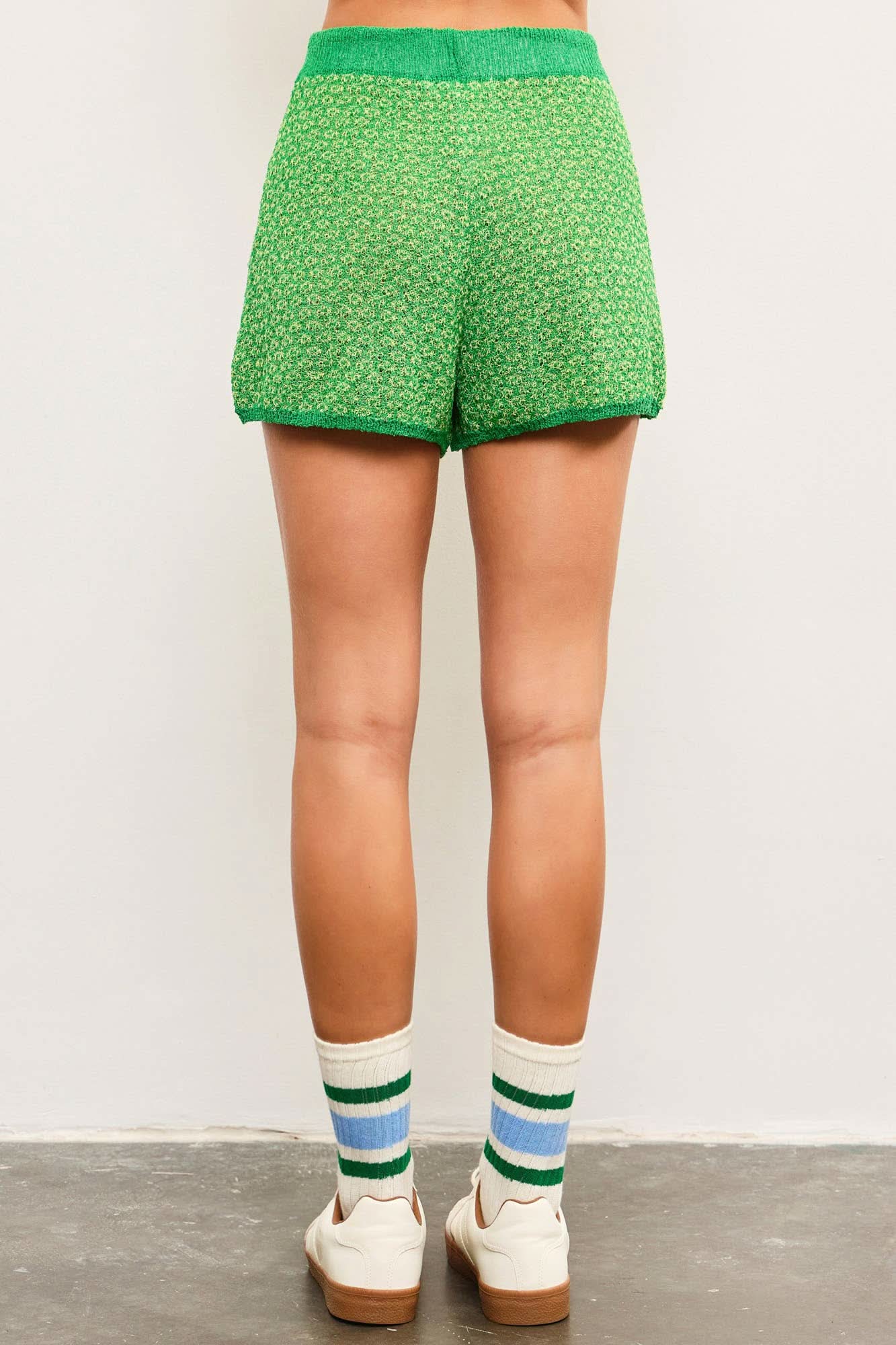 Green patterned shorts worn comfortable tie waist allows for a customizable fit.