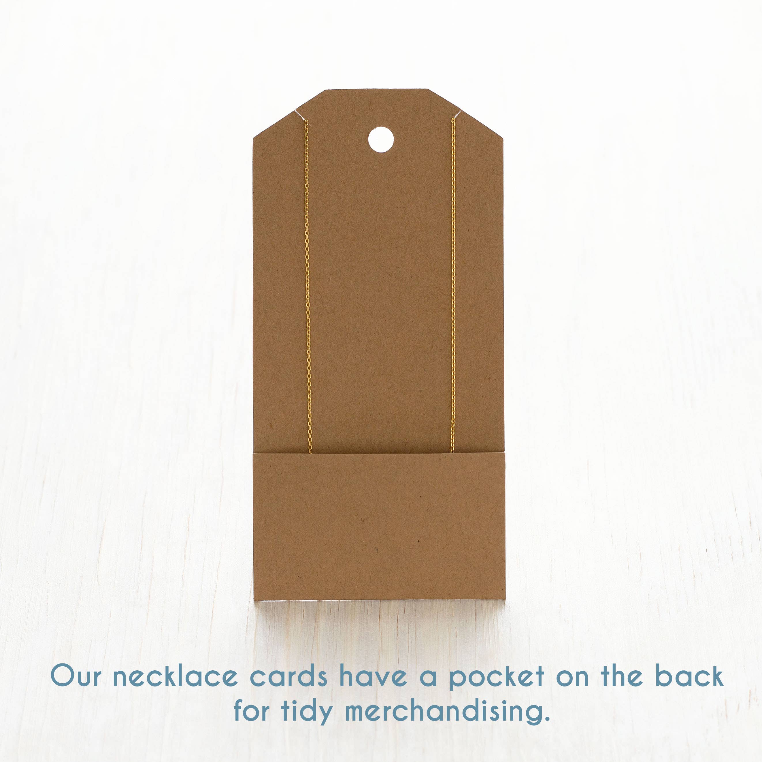 Brown cardboard necklace card with a pocket on the back, on a white background.