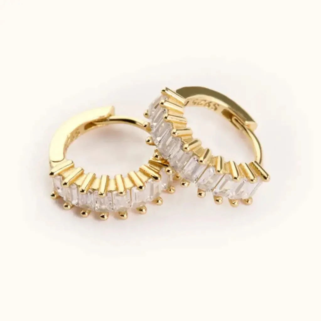 Medium sized waterproof gold CZ hoop earrings on white background 