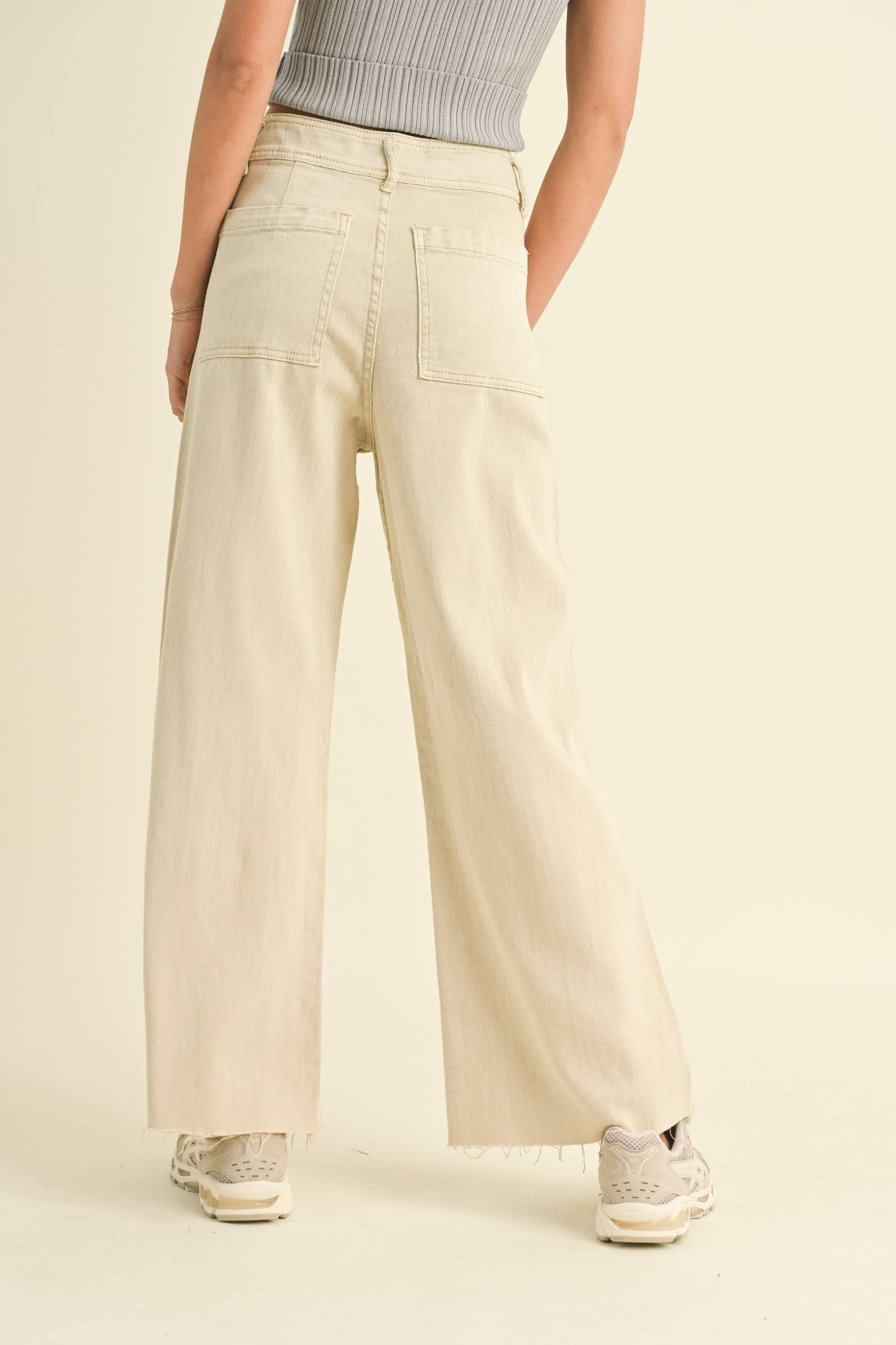 Person wearing beige wide-leg pants classic shape Look