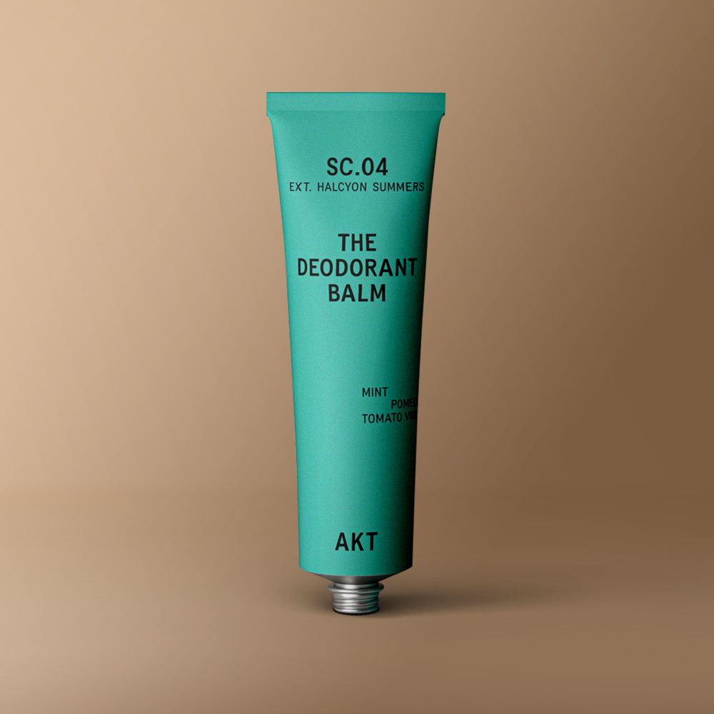 Deodorant balm in Aqua green metal tube standing upright 