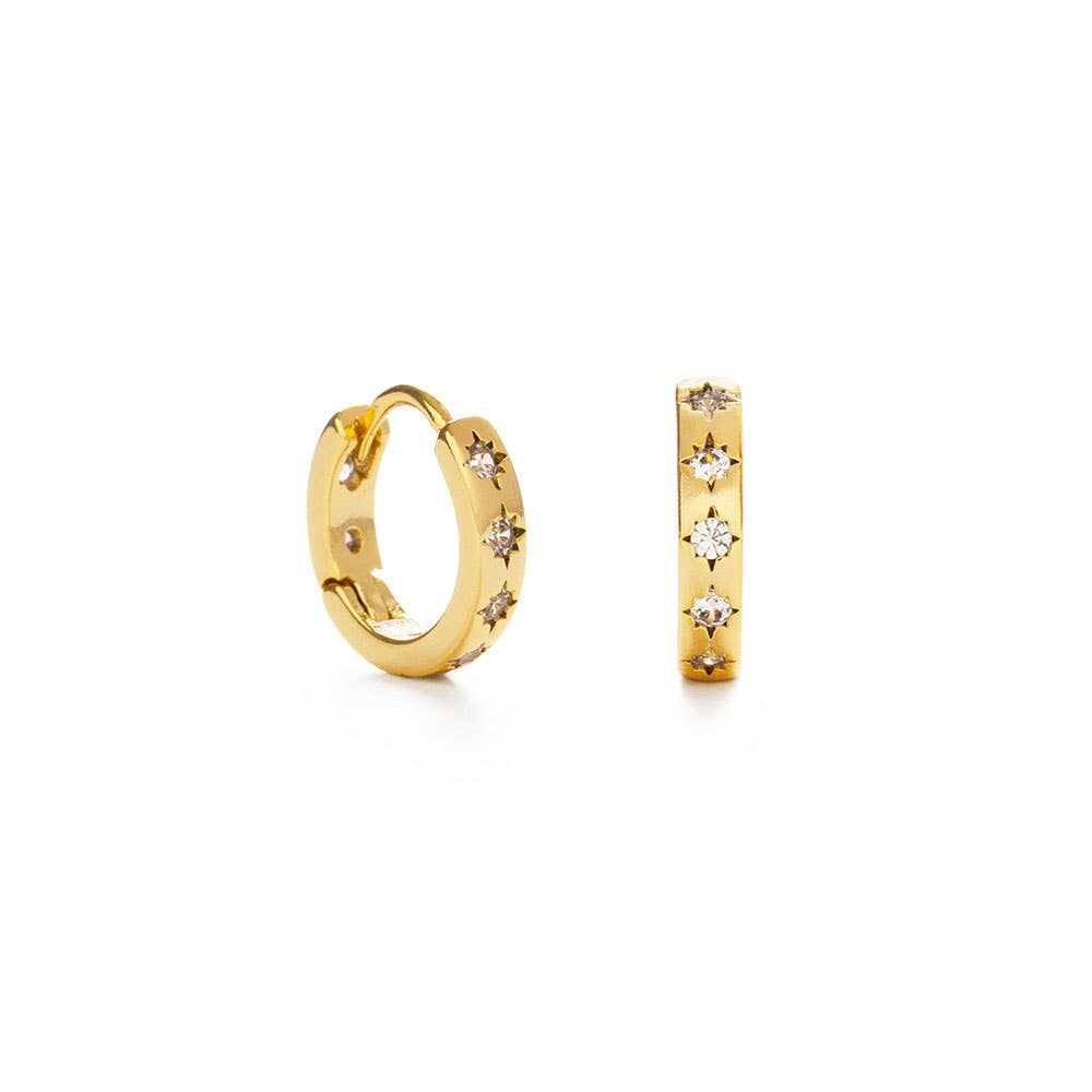 Gold hoop earrings with small diamonds on a white background