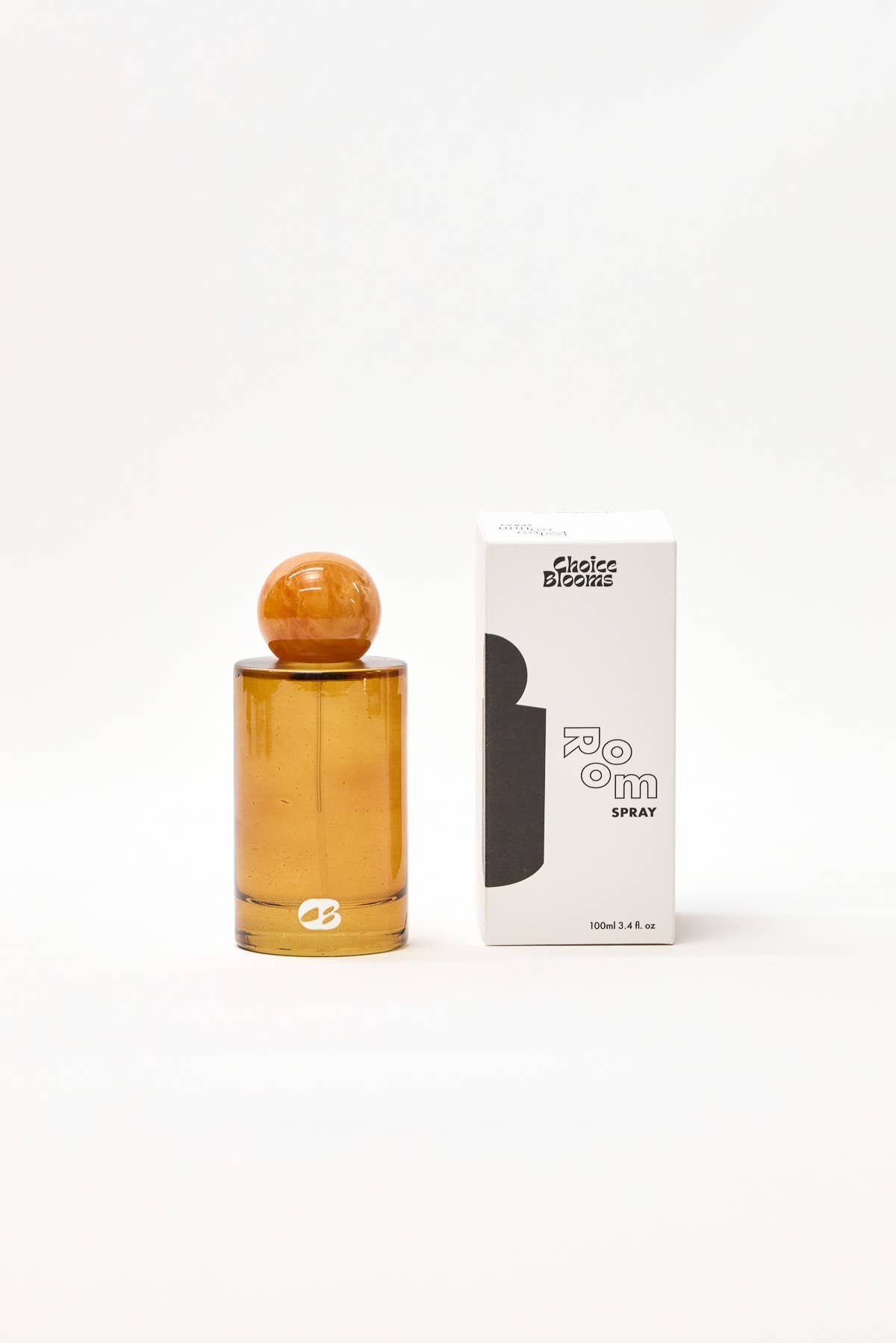 Amber perfume bottle with wooden cap and packaging on a white background