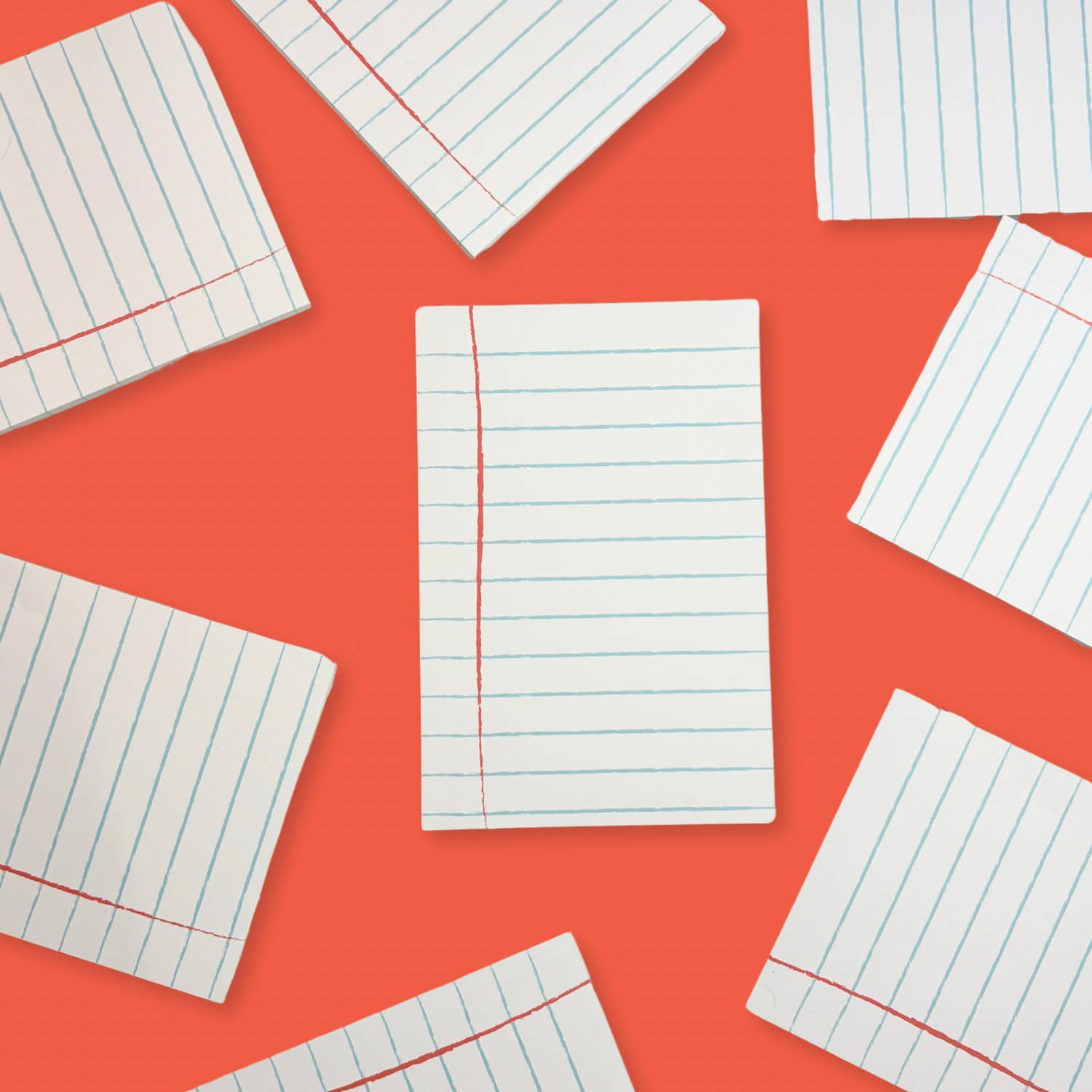 Lined paper sheets on a red background