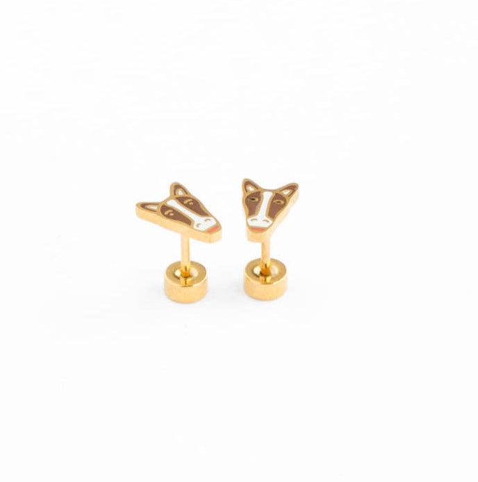 A pair of Brown and white horse flat-back gold earrings laying on a white background 