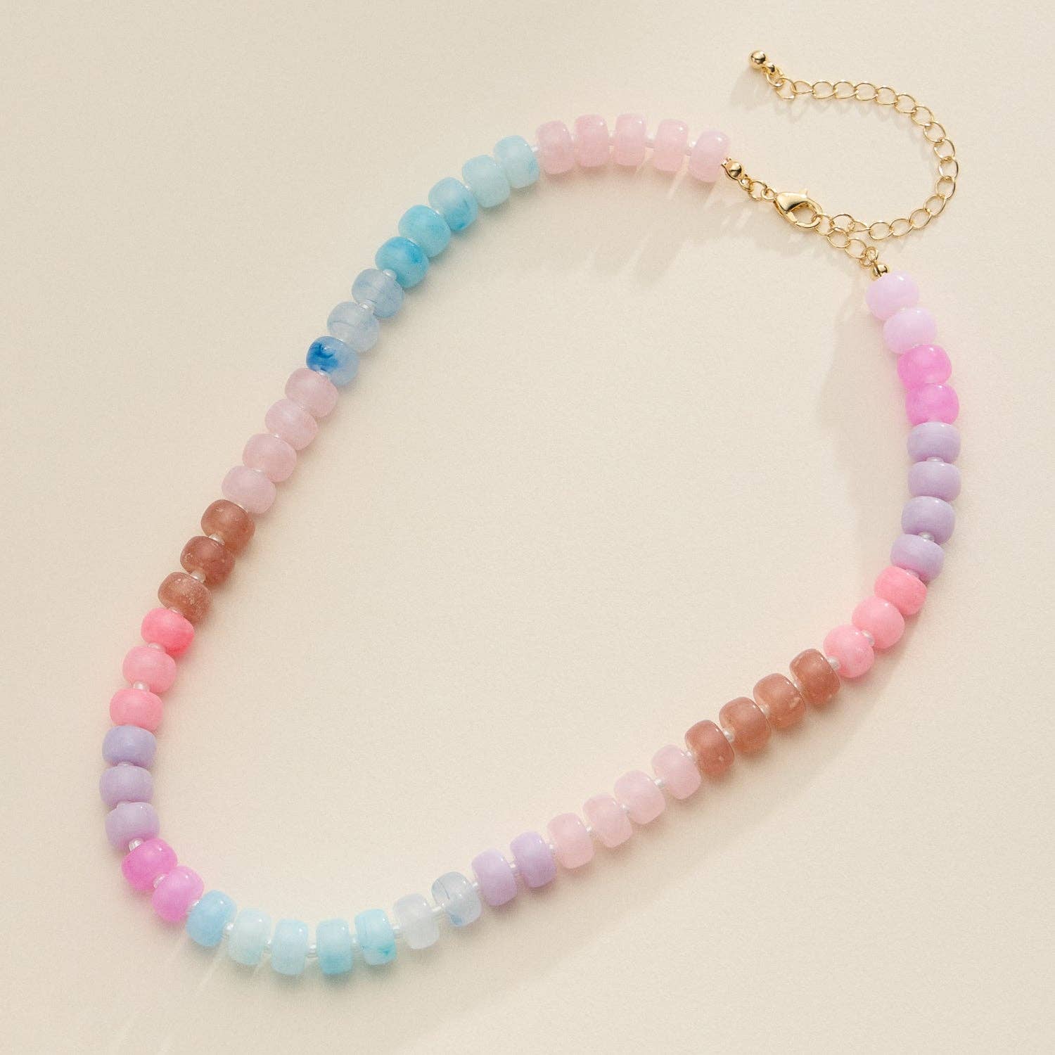 Brown pink blue and purple beaded necklace with gold clasp
