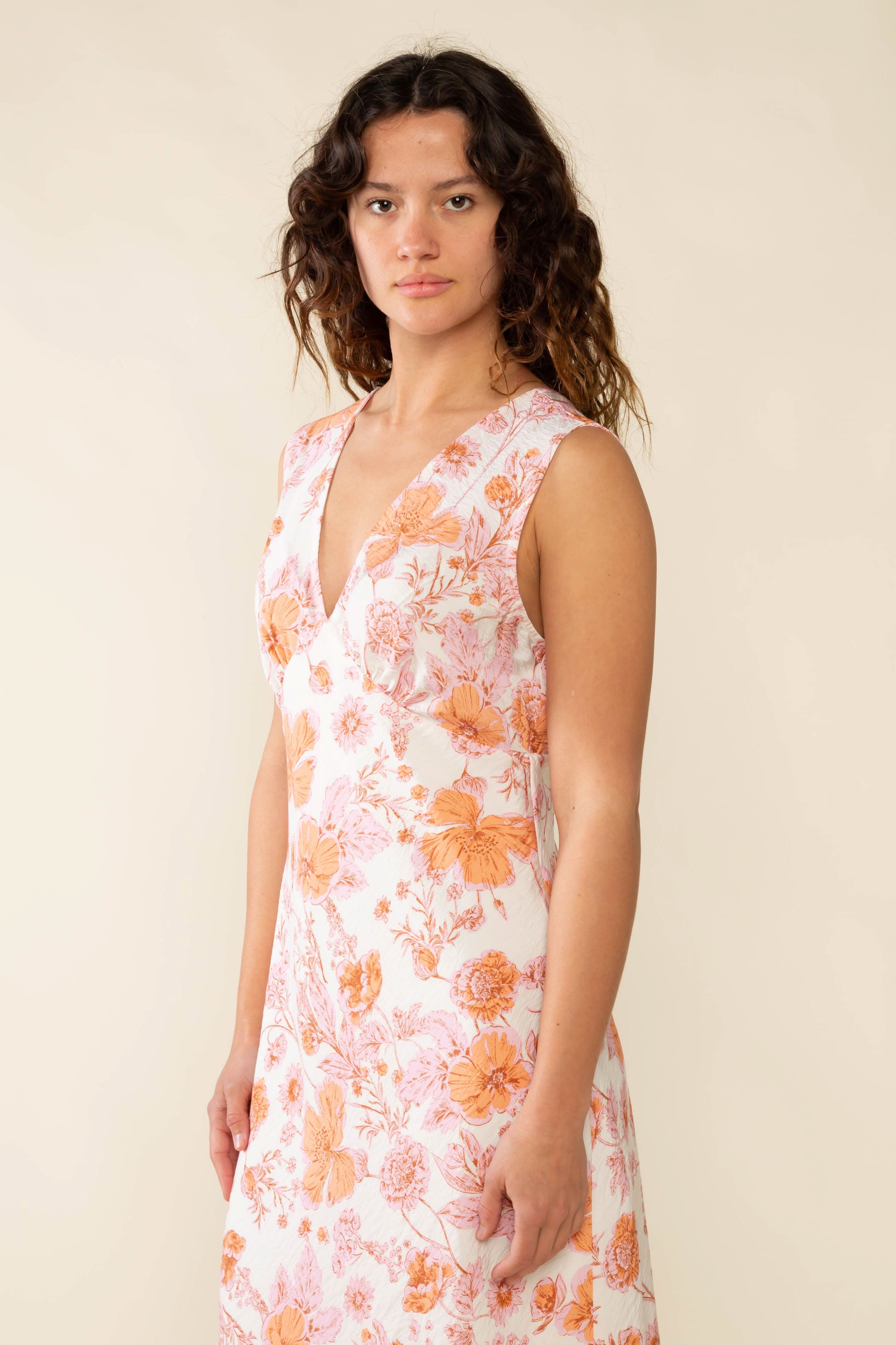 Woman wearing a floral dress Clara Bias Midi Dress - Made in L.A.