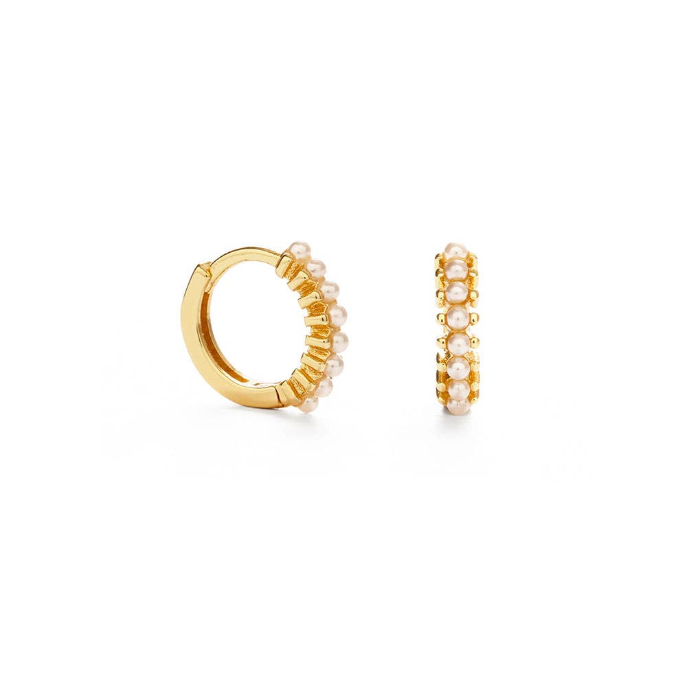 Gold hoop earrings with pearl-like beads on a white background