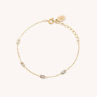 Gold chain bracelet with four rectangle crystals along the chain 
