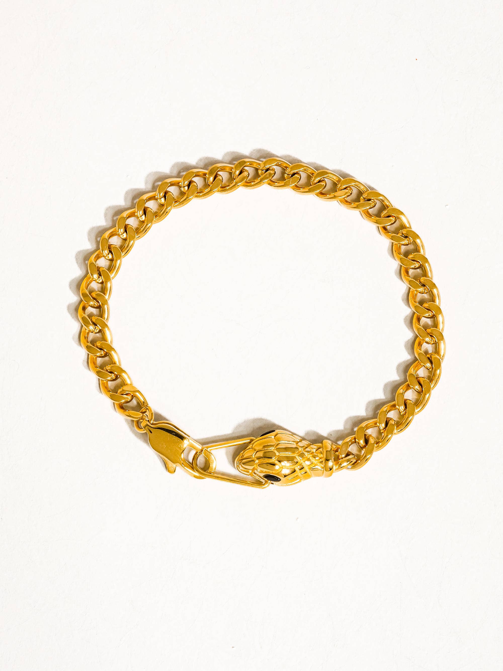 Gold chain bracelet on a white background