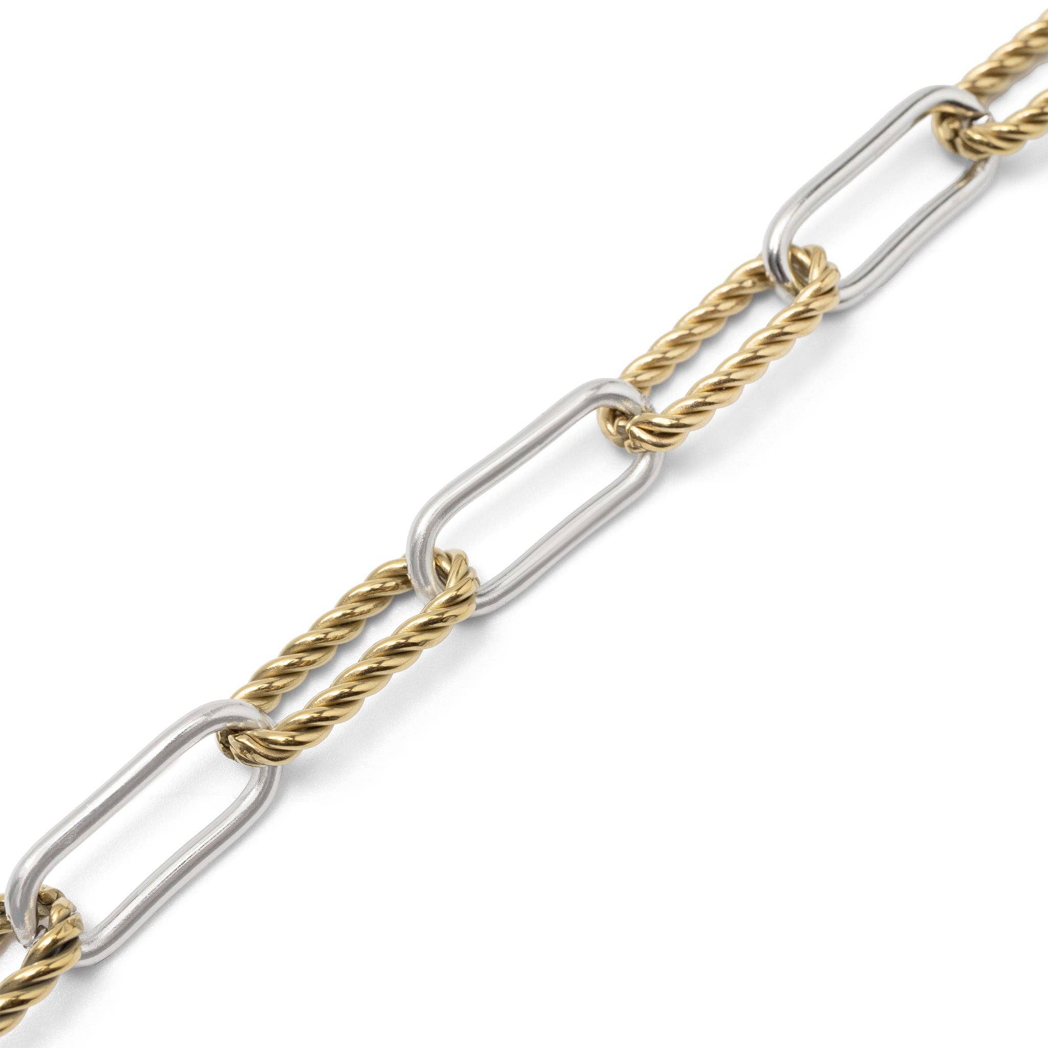 Two-tone gold and silver chain on a white background
