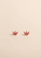 Pink Opal Stones set in a small crown set of gold with beige background 