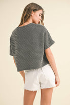 back view of model wearing Textured Stripe Top with Pocket made entirely of  Cotton