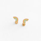Pair of Pastel hue rainbow flat back earrings laying on a white surface 