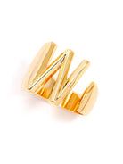 Gold adjustable letter ring on white background in letter W