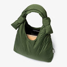 open inside view big green quilted, puffy, double knot, recycled material shoulder bag