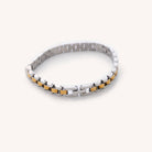 Waterproof silver and gold Cuban Link 6" plus a 2" extender laying on white background 