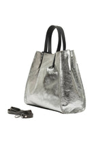 silver metallic leather handbag with black handle and black strap