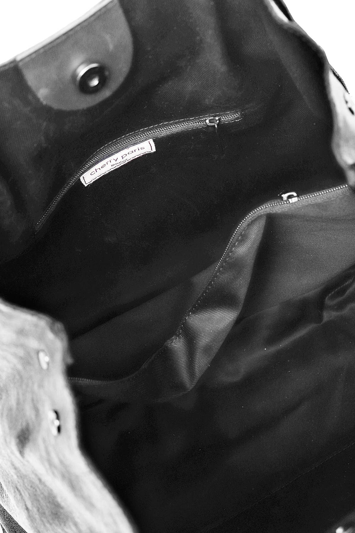 Inside of silver metallic leather handbag with interior