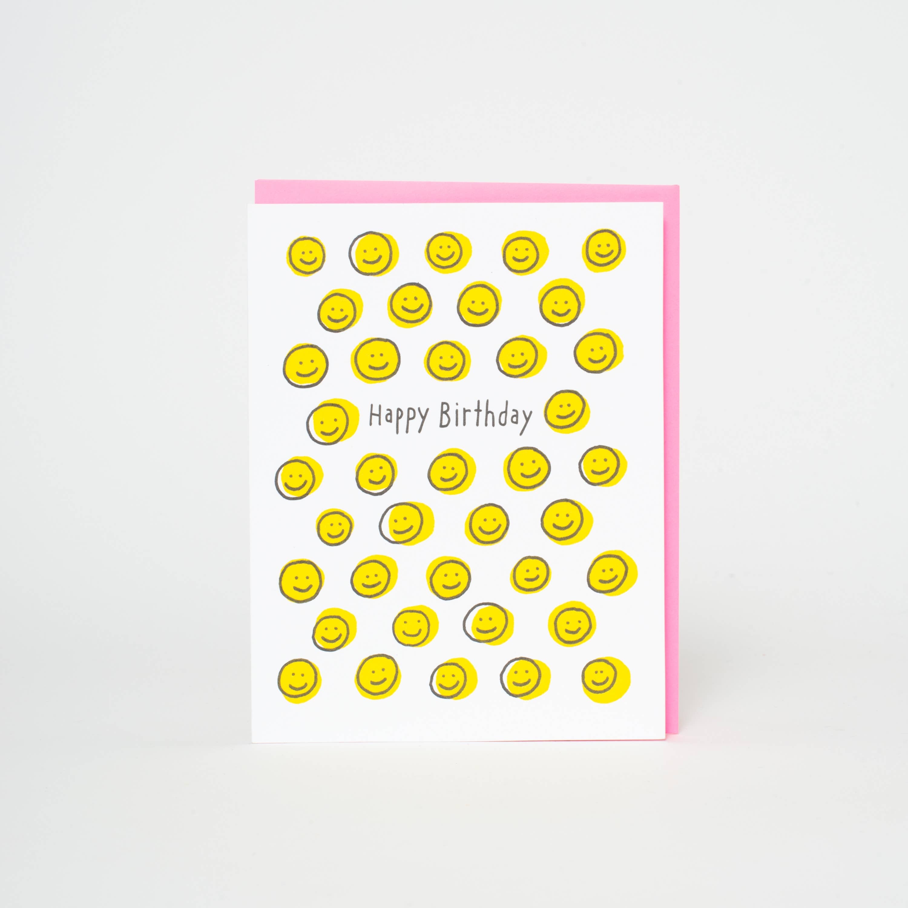 Card with yellow smiley face pattern and 'Happy Birthday' text on a white background