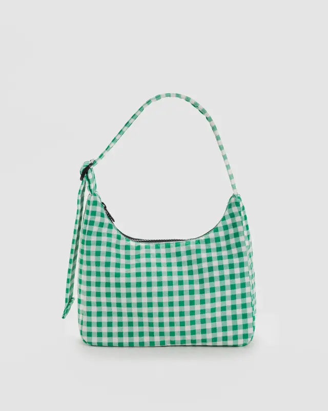 BAGGU Green gingham nylon shoulder bag sitting against white background 