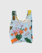 BAGGU reuse-able light blue bag design with big colorful and nature flowers, on white background 