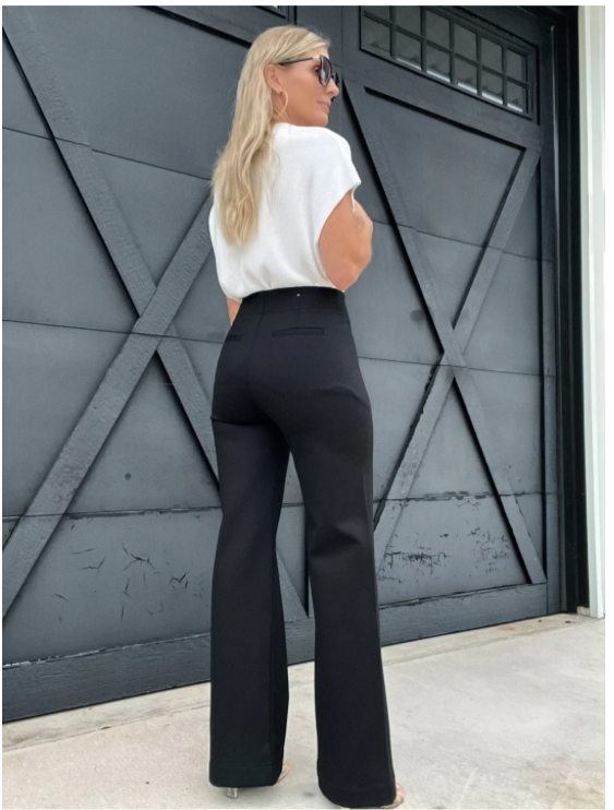 Made from soft fabric, these wide-leg pants feature double buttons for a unique touch.