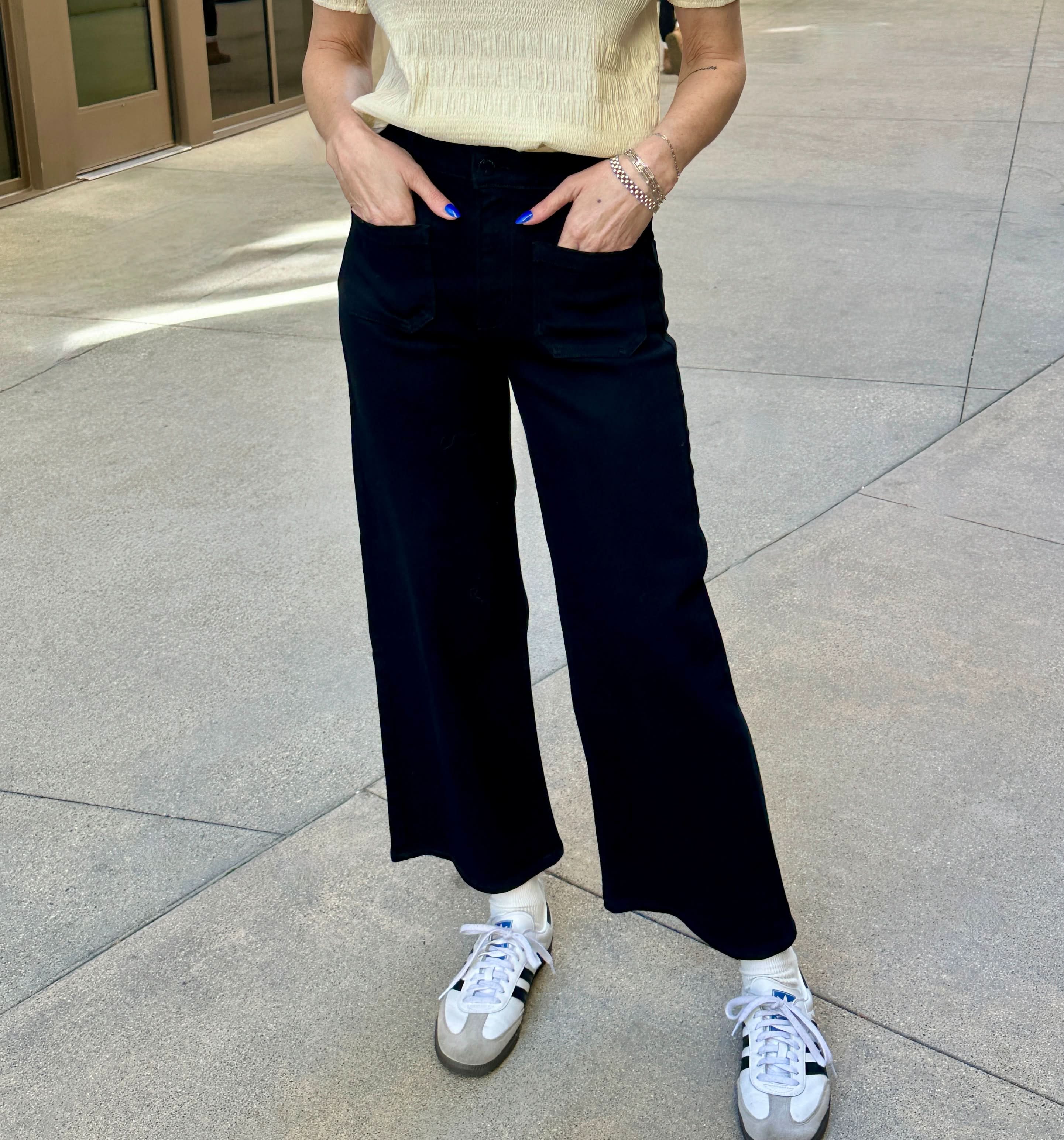 black wide-leg pants worn super-casual with sneakers for ultimate versatility.