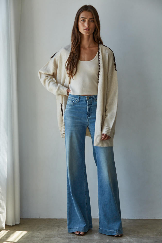 Woman wearing a beige cardigan, Lotte Contrast Stitch Open Cardigan