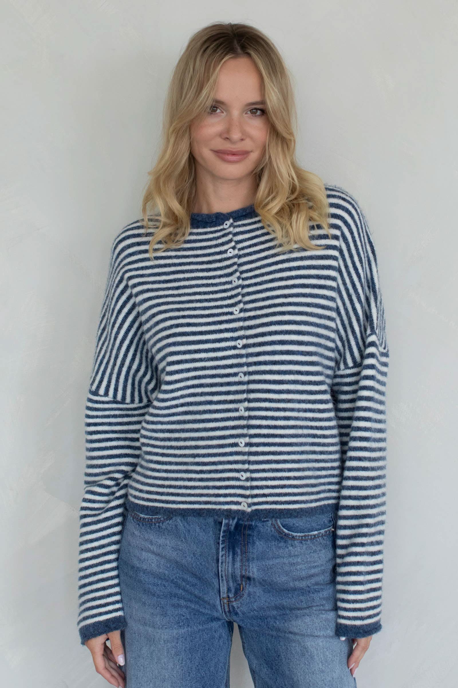 Woman wearing a blue and white striped sweater