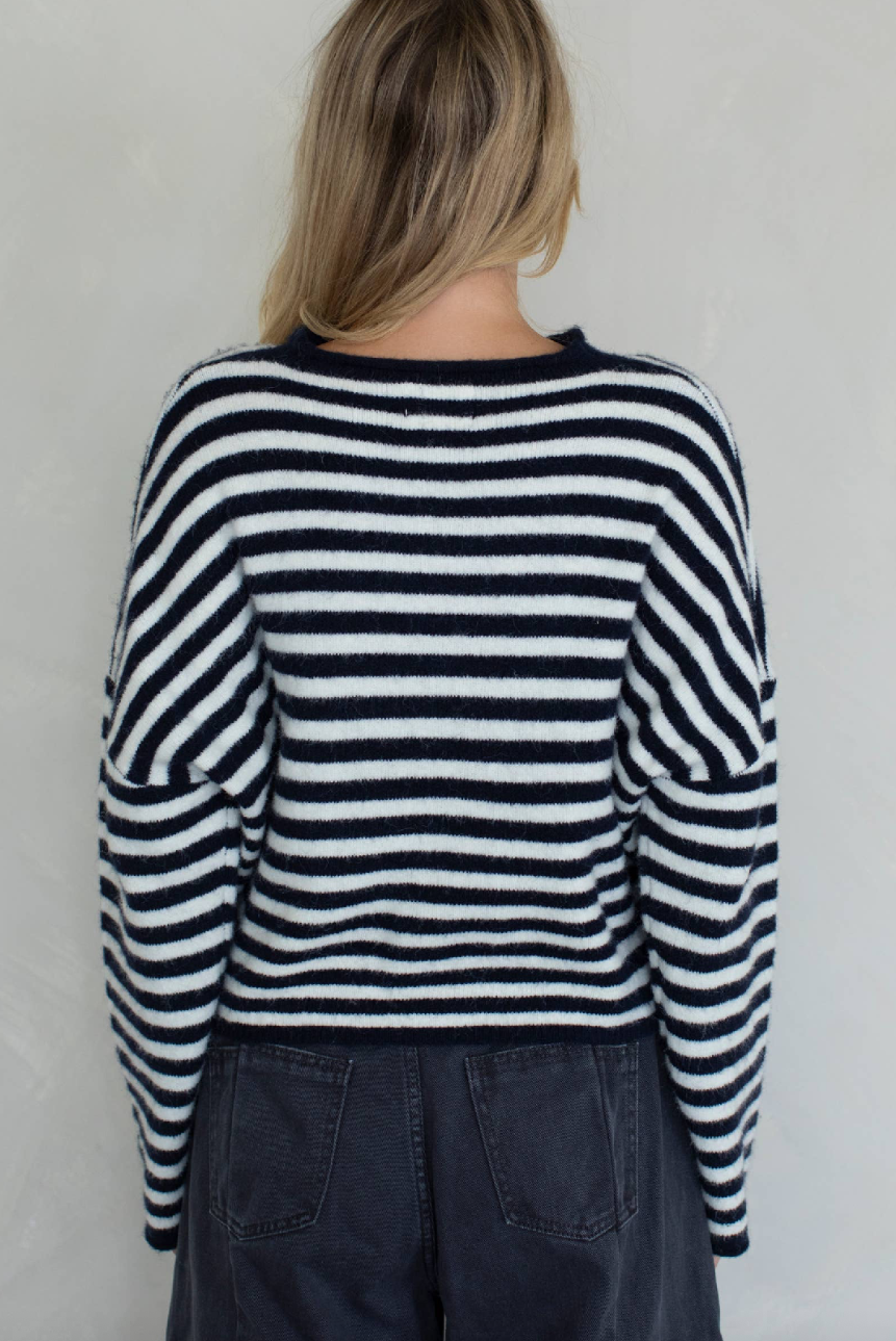 Person wearing a black and white striped sweater