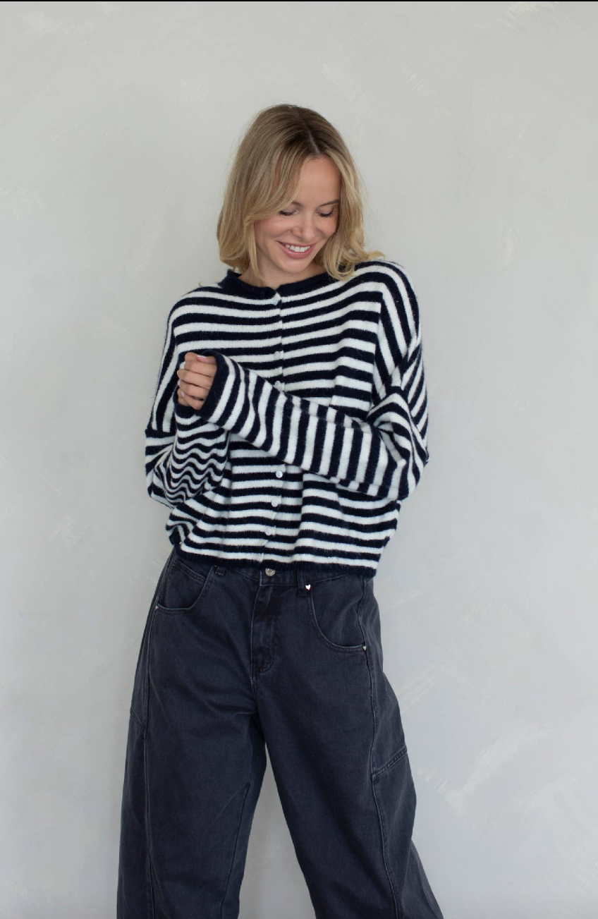 Person wearing a black and white striped sweater 