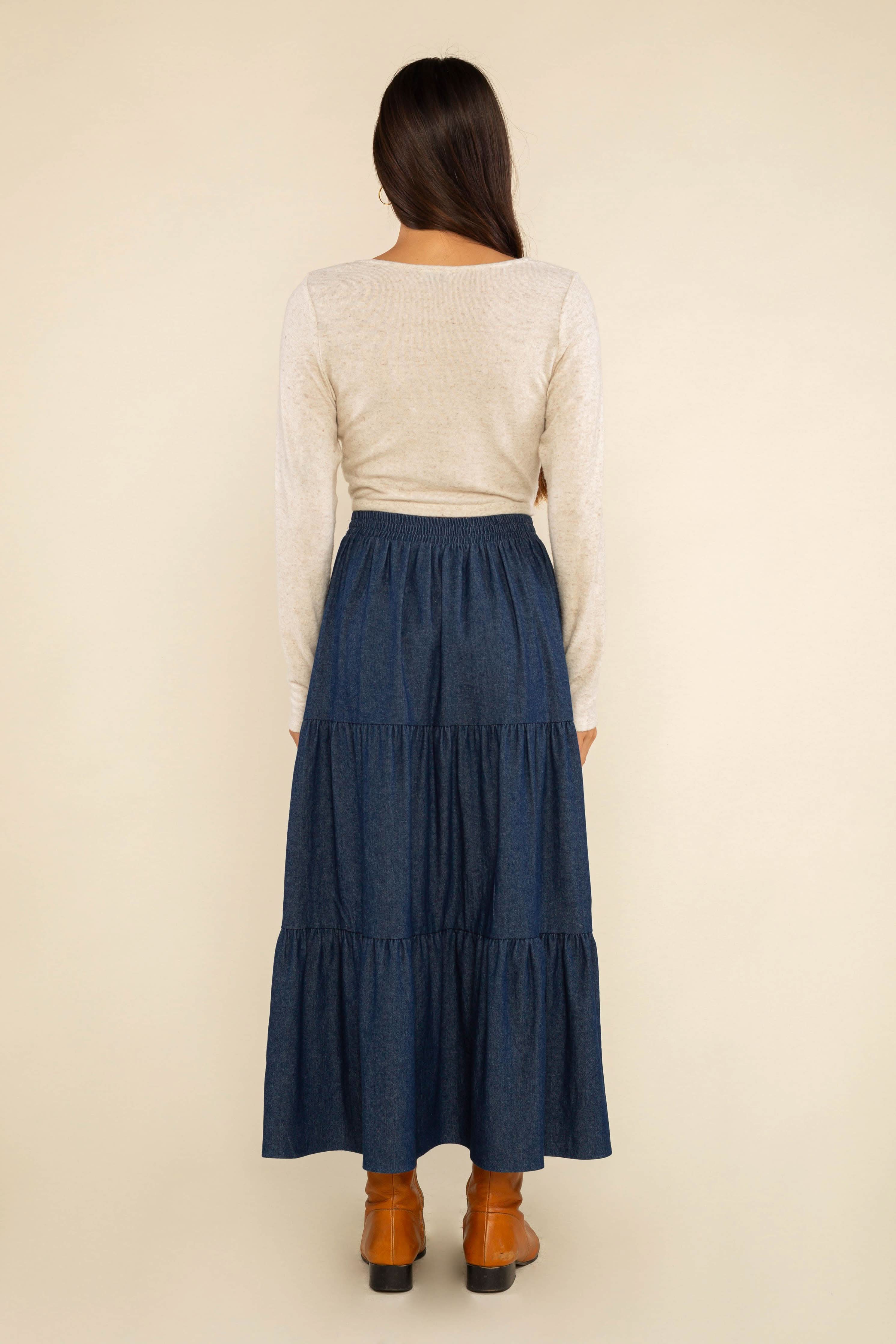 long navy tiered skirt It’s a versatile, stylish item that will make a statement in any collection