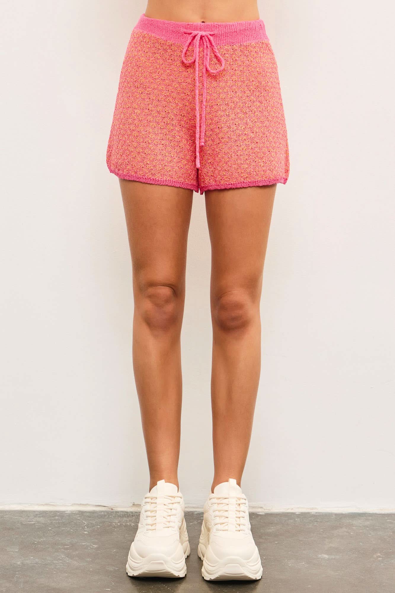 Person wearing pink shorts perfect for any occasion effortless style